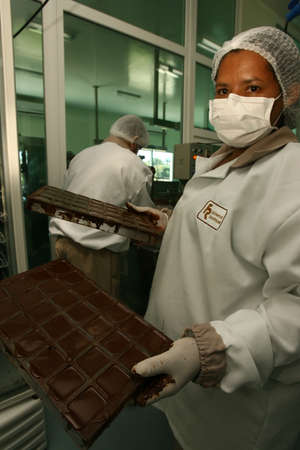 ilheus, bahia / brazil - august 7, 2011: Employee is seen in a chocolate gurmet factory in the city of Ilheus.のeditorial素材