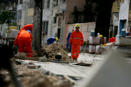salvador, bahia / brazil - july 23, 2015: Workers are seen working on recovery works on Avenida Beira Mar in the Ribeira neighborhood in the city of Salvador.のeditorial素材