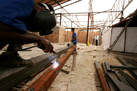 porto Seguro, bahia / brazil - november 10, 2010: civil construction workers are seen working on...