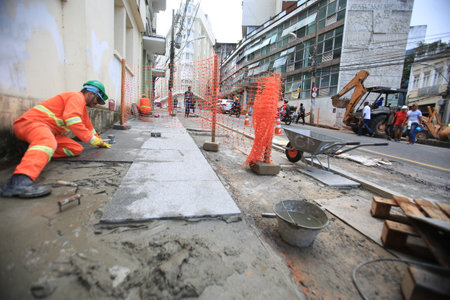 salvador, bahia / brazil - april 1, 2019: Workers are seen in a street requalification work in the city center of Salvador.のeditorial素材