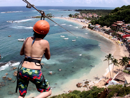 cairu, bahia / brazil - november 14, 2013: Tourist enjoy the look during the 70 meter high zip line jump in Morro de Sao Paulo.のeditorial素材