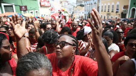 salvador, bahia / brazil - december 4, 2019: Devotees of Santa Barbara and Candombe supporters celebrate Mass in honor of sits in Pelourinho, Historic Center of the city of Salvador.のeditorial素材
