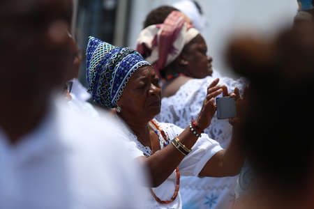 salvador, bahia / brazil - november 6, 2018: women members of Candomble are seen doing painting on a candomble terreiro wall in the city of Salvador.のeditorial素材