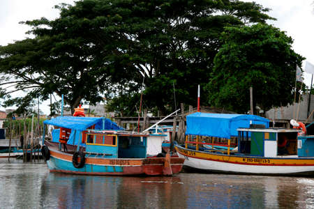 caravelas, bahia / brazil - march 25, 2008: fishing boats are seen near the port of the city of caravelas.のeditorial素材