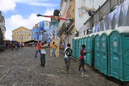 salvador, bahia / brazil - February 22, 2017: Man with mask and motor on his back is seen at Pelourinho, disinfecting chemical toilets for use during carnival.のeditorial素材