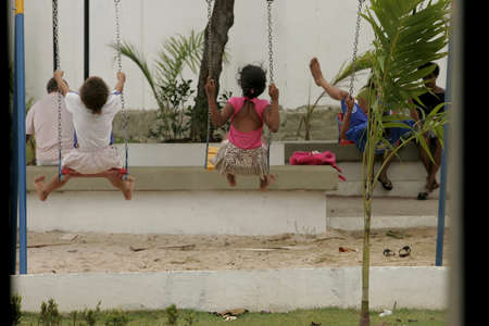 salvador, bahia / brazil - october 2, 2012: Children are seen playing quietly on a playground in the Tancredo Neves neighborhood of Salvador.のeditorial素材