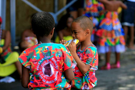 salvador, bahia / brazil - march 3, 2014: Children are seen in the Campo Grande neighborhood during the carnival in the city of Salvador.のeditorial素材