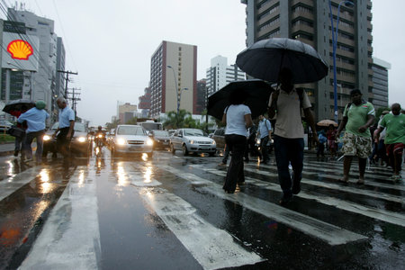 salvador, bahia / brazil - april 23, 2013: people are seen using rain guideways during pedestrian crossings in the city of Salvador, Bahia.のeditorial素材