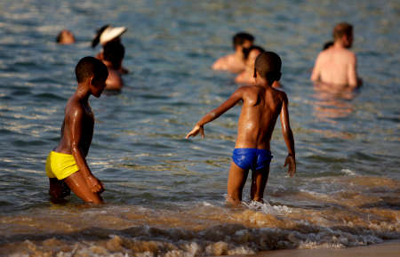 salvador, bahia / brazil - february 17, 2015: people are seen during a sea bath at Barra beach in the city of Salvador.のeditorial素材