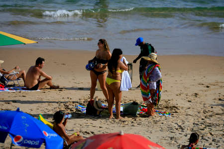 salvador, bahia / brazil - december 29, 2013: People are seen at Porto da Barra beach in the city of Salvador.のeditorial素材
