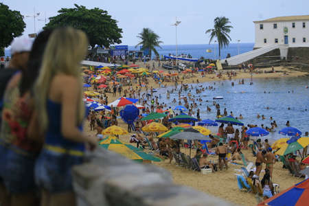 salvador, bahia / brazil - december 29, 2013: People are seen at Porto da Barra beach in the city of Salvador.のeditorial素材