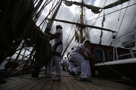 salvador, bahia, brazil - October 19, 2018: Crew of the White Swan ship is seen during operation on the vessel in Todos Santos Bay.のeditorial素材