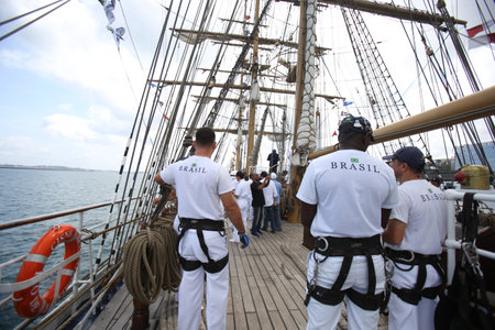 salvador, bahia, brazil - October 19, 2018: Crew of the White Swan ship is seen during operation on the vessel in Todos Santos Bay.のeditorial素材