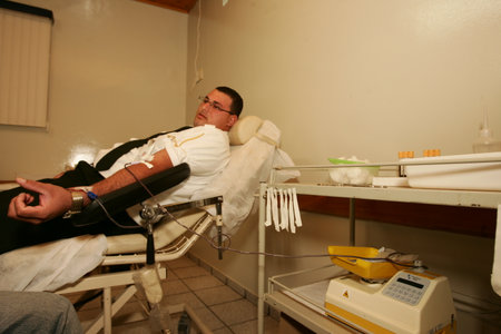 eunapolis, bahia / brazil - july 27, 2010: patient is vito during blood sample collection for examination at health fair in the city of Eunapolis.のeditorial素材