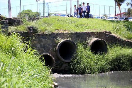 lauro de freitas, bahia / brazil - november 21, 2017: Ipitanga river in the center of Lauro de Freitas. The river is contaminated by domestic and industrial backwaters.のeditorial素材