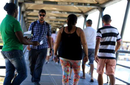 salvador, bahia / brazil - november 12, 2015: person is seen distributing advertising pamphlet in the city of Salvador.のeditorial素材