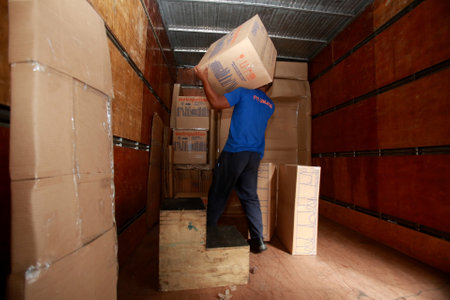salvador, bahia / brazil - may 13, 2015: Employees of the carrier are seen arranging objects for changing customers in the city of Salvador.のeditorial素材