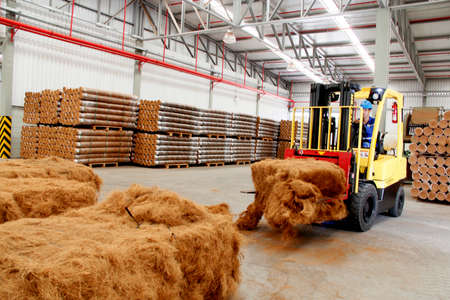 conde, bahia / brazil - july 17, 2013: forklift is seen carrying coconut fibers at a factory in the city of Condeのeditorial素材