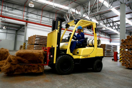 conde, bahia / brazil - july 17, 2013: forklift is seen carrying coconut fibers at a factory in the city of Condeのeditorial素材