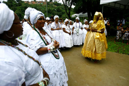 salvador, bahia / brazil - outobro 4, 2014: young man is seen at Parque Sao Bartolomeu in Salvador, wearing costumes from the orixa Oxum, a Candomble entity that reigns in fresh waters.のeditorial素材