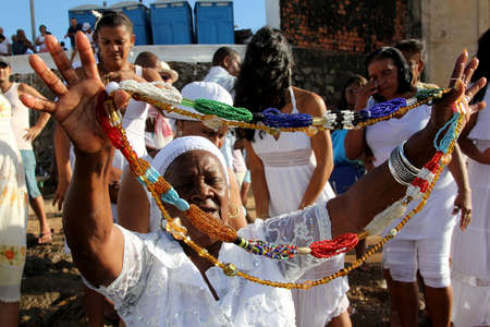 salvador, bahia / brazil - february 2, 2014: devotees and admirers of the orixa yemanja, a candomble entity, seen on the rio Vermelho beach, in the city of salvador, during a religious celebration.のeditorial素材