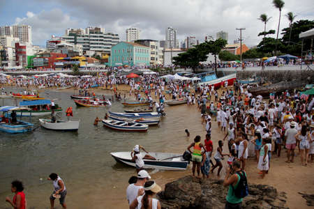 salvador, bahia / brazil - february 2, 2014: devotees and admirers of the orixa yemanja, a candomble entity, seen on the rio Vermelho beach, in the city of salvador, during a religious celebration.のeditorial素材