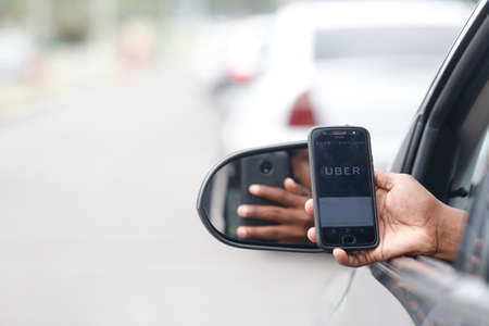 salvador, bahia / brazil - june 14, 2018: Uber driver application, passenger transport is seen in...