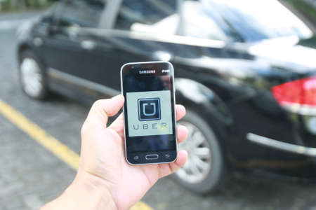 salvador, bahia / brazil - june 14, 2018: Uber driver application, passenger transport is seen in...