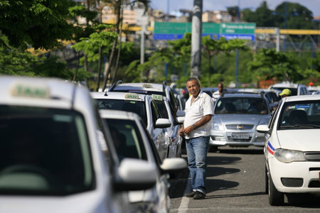 salvador, bahia / brazil - march 10, 2014: Taxi drivers are seen in a row near the Iguatemi Mall in the city of Salvador.のeditorial素材