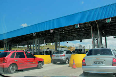 simoes filho, bahia / brazil - october 1, 2012: vehicles are seen in a toll line on highway BR 324...