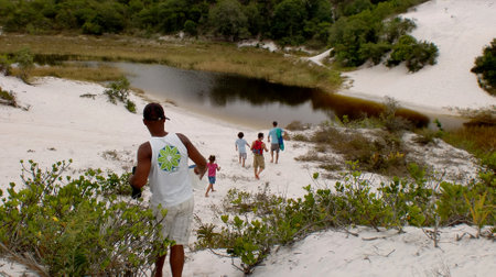 salvador, bahia / brazil - september 7, 2011: people are seen on the sand dune in the Itapua region in the city of Salvador.のeditorial素材