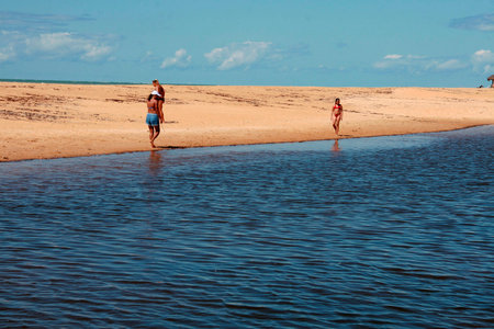 santa cruz cabralia, bahia / brazil - july 26, 2008: people play in the water of the Guaiu River in the Santo Andre district in Santa Cruz Cabralia.のeditorial素材