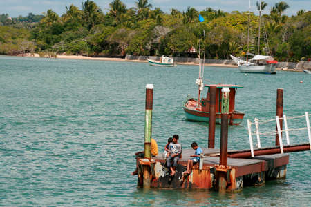 santa cruz cabralia, bahia / brazil - july 26, 2008: people play in the water of the Guaiu River in the Santo Andre district in Santa Cruz Cabralia.のeditorial素材