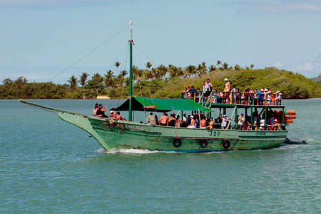 santa cruz cabralia, bahia / brazil - july 26, 2008: schooner passengers are seen on the Jooo de Tiba River in the municipality of Santa Cruz Cabralia.のeditorial素材