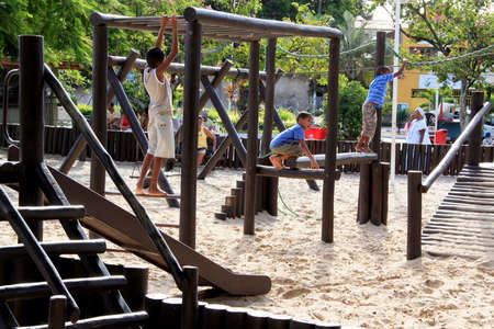 salvador, bahia / brazil - september 7, 2013: Children are seen playing in a playground near Lagoa do Abaete in the city of Salvador.のeditorial素材