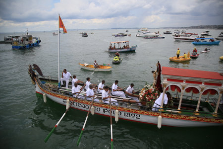salvador, bahia / brazil - januuary 1, 2020: Sailors are seen aboard the Gratidao do Povo Galeota carrying the image of Bom Jesus dos Navegantes to Ponta de Humaita beach in the All Saints Bay in Salvador. *** Local Caption ***のeditorial素材
