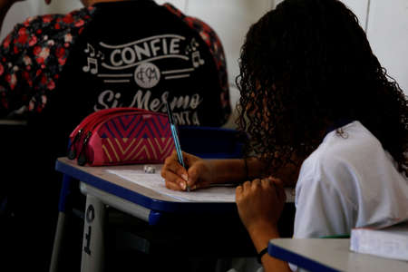 pojuca, bahia / brazil - august 1, 2019: teacher and her students are seen in a public school classroom in the city of Pojuca.のeditorial素材