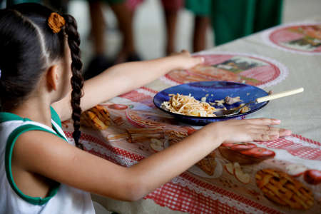 pojuca, bahia / brazil - August 1, 2019: School lunch is served to public school students in the city of Pojuca.のeditorial素材