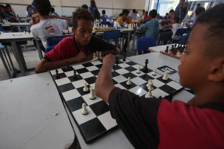 salvador, bahia / brazil - november 8, 2018: Public school students in the Paz neighborhood of Salvador are seen playing chess.のeditorial素材