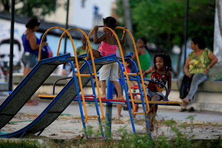 salvador, bahia / brazil - may 20, 2014: Children are seen playing in a playground in the Tancredo Neves neighborhood in Salvador.のeditorial素材