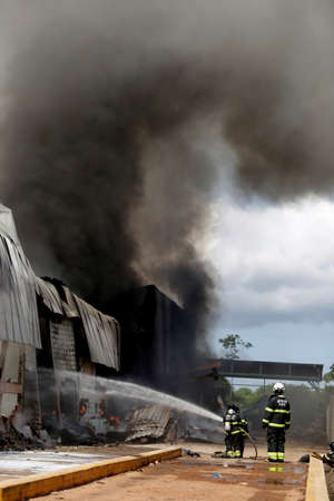 sao sebastiao do passe, bahia / brazil - may 31, 2019: Firefighters fire fighting at tire recycling...
