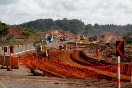 camacari, bahia / brazil - march 5 2013: workers at the construction site for the duplication of the BA 535 highway in the city of Camacari.のeditorial素材