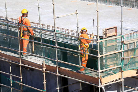salvador, bahia / brazil - may 6, 2015: Workers work together to traffic vehicles on Avenida Antonio...