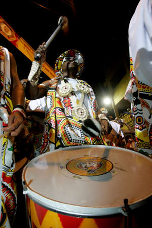 salvador, bahia / brazil - february 9, 2013: member of the Bloco Ile Aiye perform Candomble rituals during the departure of the block in the neighborhood of Curuzu in Salvador.のeditorial素材