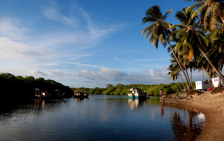 conde, bahia / brazil - march 28, 2013: Fishing boats are seen in the Itapicuru River port in the Pocas community, Conde municipality.のeditorial素材