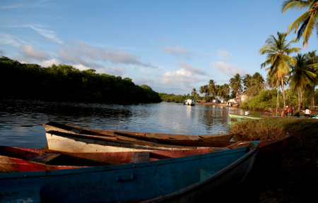 conde, bahia / brazil - march 28, 2013: Fishing boats are seen in the Itapicuru River port in the Pocas community, Conde municipality.のeditorial素材