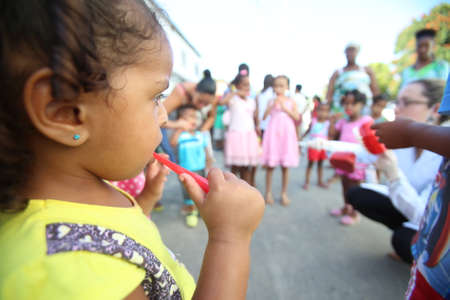 salvador, bahia / brazil - october 20, 2017: Children are seen during social action and tooth brushing learning in day care center of Salvador city.のeditorial素材