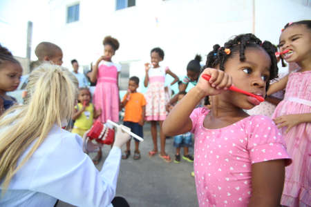 salvador, bahia / brazil - october 20, 2017: Children are seen during social action and tooth brushing learning in day care center of Salvador city.のeditorial素材