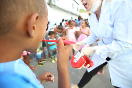 salvador, bahia / brazil - october 20, 2017: Children are seen during social action and tooth brushing learning in day care center of Salvador city.のeditorial素材