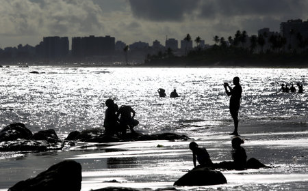 salvador, bahia / brazil - september 6, 2015: People are seen on rocks of Itapua Beach in Salvador.のeditorial素材